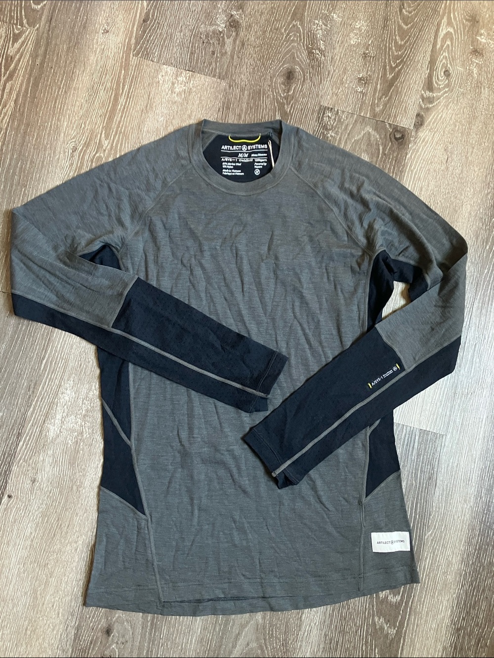 Artilect Systems men's long sleeve base layer tee in gray and black.